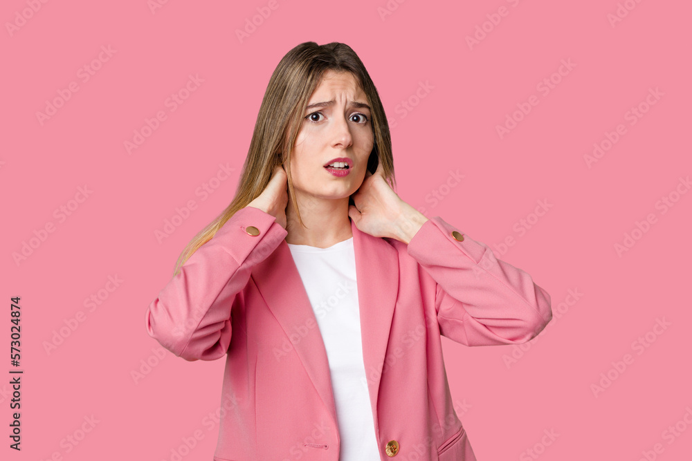 Young blonde posing for a portrait isolated, exuding natural beauty and radiance touching back of head, thinking and making a choice. Young blonde posing for a portrait isolated, exuding natural beauty and radiance touching back of head, thinking and making a choice.