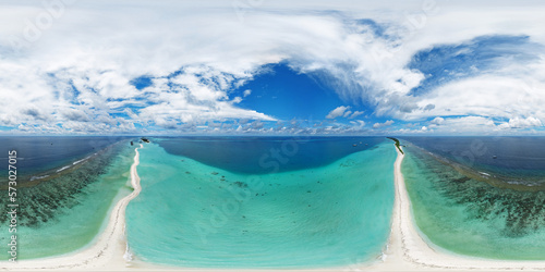 Fototapeta Naklejka Na Ścianę i Meble -  Panoramic view of one of the atolls in the Maldives from a bird's eye view. A thin strip of land of sand connecting the larger parts of the island. Aerial seamless 360 degree spherical panorama