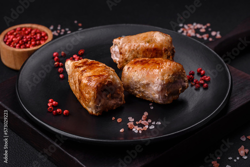 Delicious chicken or pork meat roll with mushrooms, cheese, spices and herbs