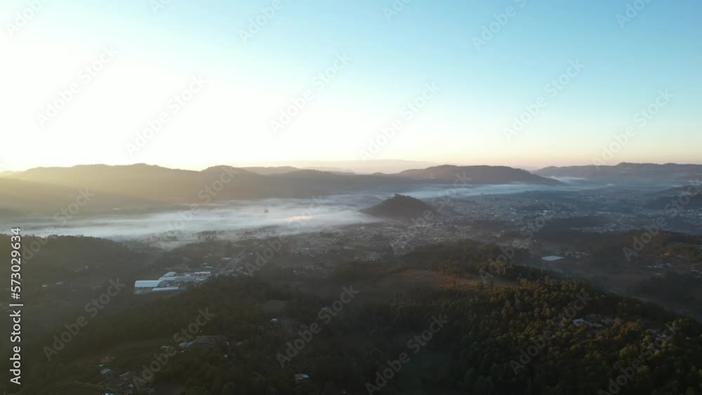 Aerial Panning Left Over Valley With Low Morning Fog And Clear Sky Above Aerial Panning Left Over Valley With Low Morning Fog And Clear Sky Above
