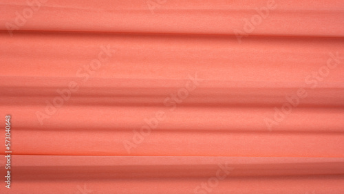 salmon color crepe paper - background with crinkled texture