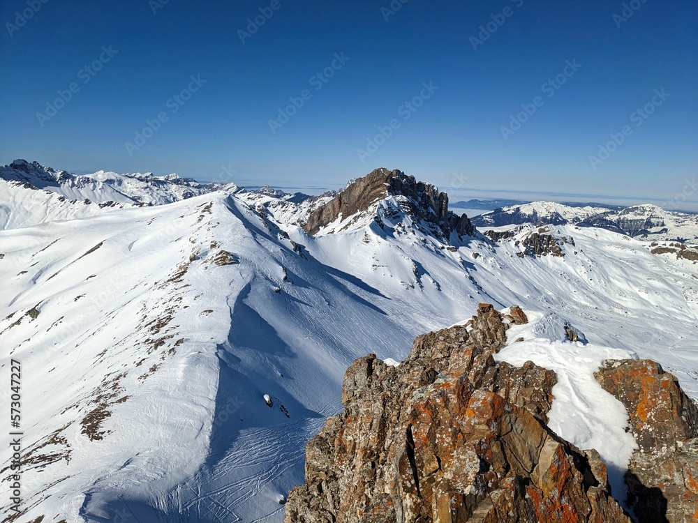 On the peak spitzmeilen above the Flumserberg. Ski mountaineering in the beautiful Swiss Alps. Ski touring in Glarus. Summit cross. High quality photo