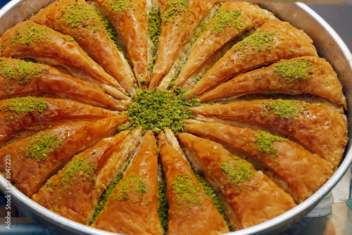 middle eastern arabic authentic dessert kunafa with phyllo pastry photo