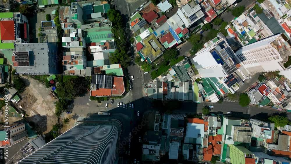 Aerial Birds Eye Overhead Top of Nha Trang street with skyscrapers of Vietnam, urban buildings street in Vietnam with busy car traffic. vietnam city view from above. 4K Aerial Birds Eye Overhead Top of Nha Trang street with skyscrapers of Vietnam, urban buildings street in Vietnam with busy car traffic. vietnam city view from above. 4K