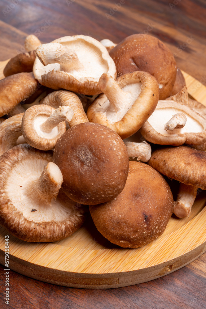 Fresh brown Lentinula edodes or shiitake edible mushrooms Fresh brown Lentinula edodes or shiitake edible mushrooms