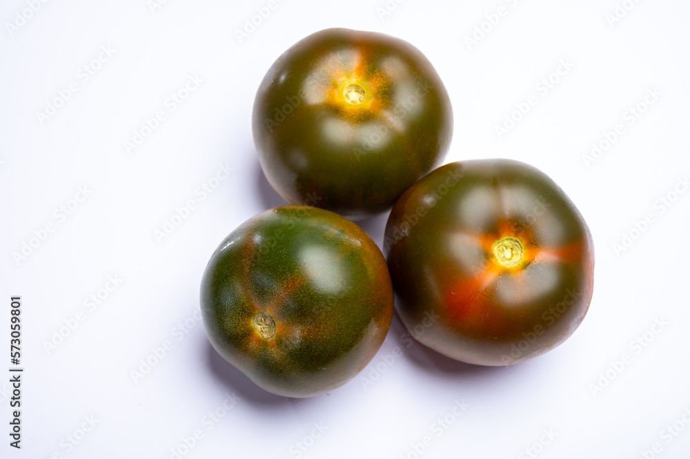 Fresh ripe sweet reddish brown and green kumato tomatoes Fresh ripe sweet reddish brown and green kumato tomatoes