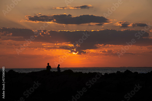 silhouette of a person at sunset © v4nish3d