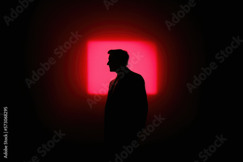 Shadows in the City: A Striking Silhouette of a Man Against a Red Square Light with Generative AI