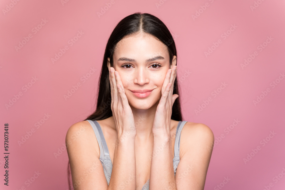 Smiling woman in underwear looking at camera on pink background Smiling woman in underwear looking at camera on pink background