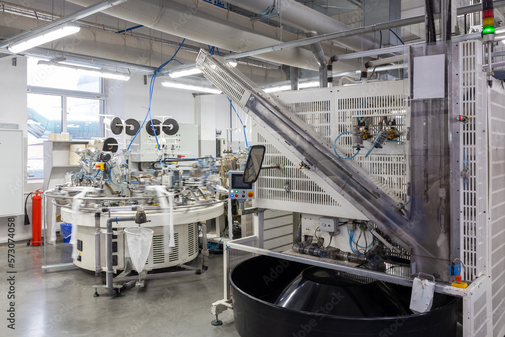 Robotic Arm in Action. Hosiery Manufacturing. Robotic Arm in Action. Hosiery Manufacturing.