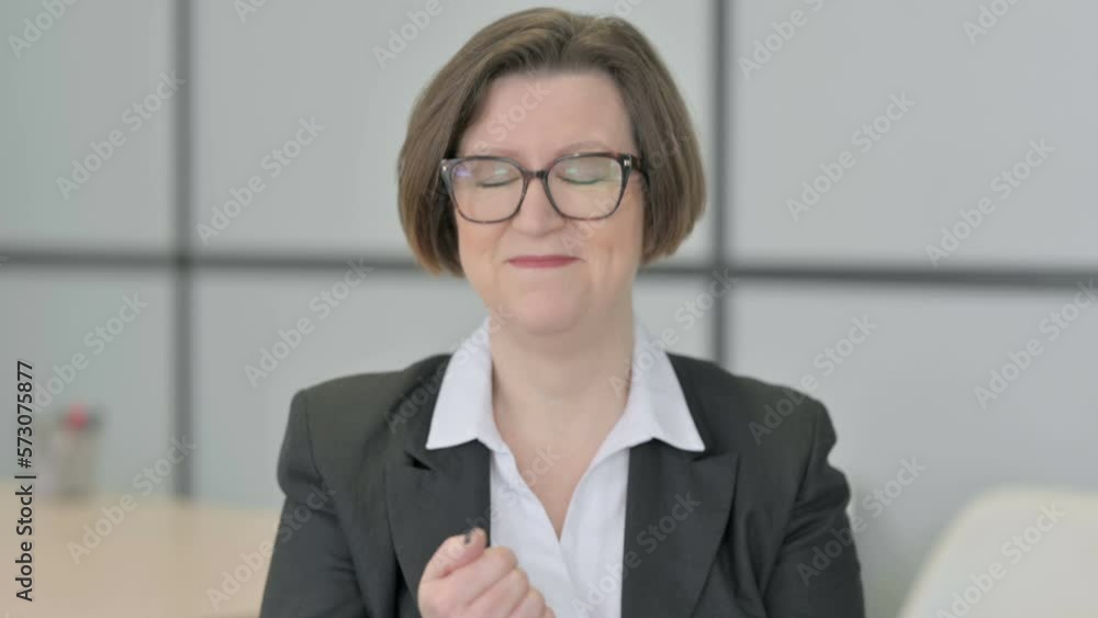 Portrait of Inviting Old Businesswoman in Office