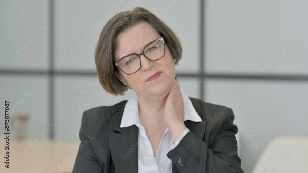 Tired Old Businesswoman Massaging Her Neck, Stretching Body Tired Old Businesswoman Massaging Her Neck, Stretching Body
