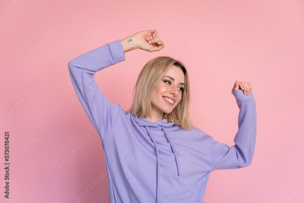 Cheerful young woman dancing in studio Cheerful young woman dancing in studio