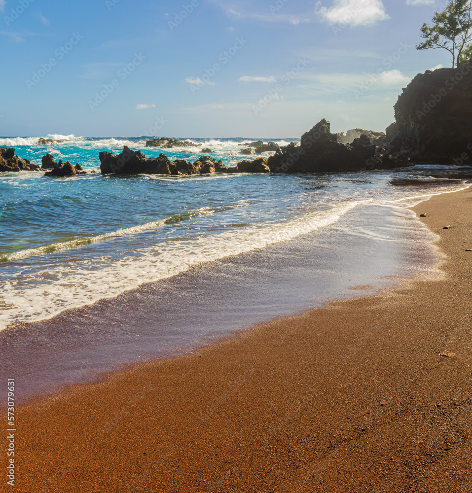 Red Sand And Blue Waves of Kaihalulu Beach, Hana, Maui, Hawaii, USA