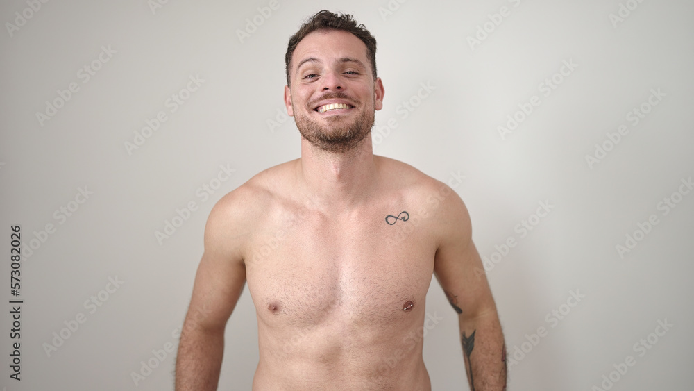 Young caucasian man standing shirtless smiling over isolated white background