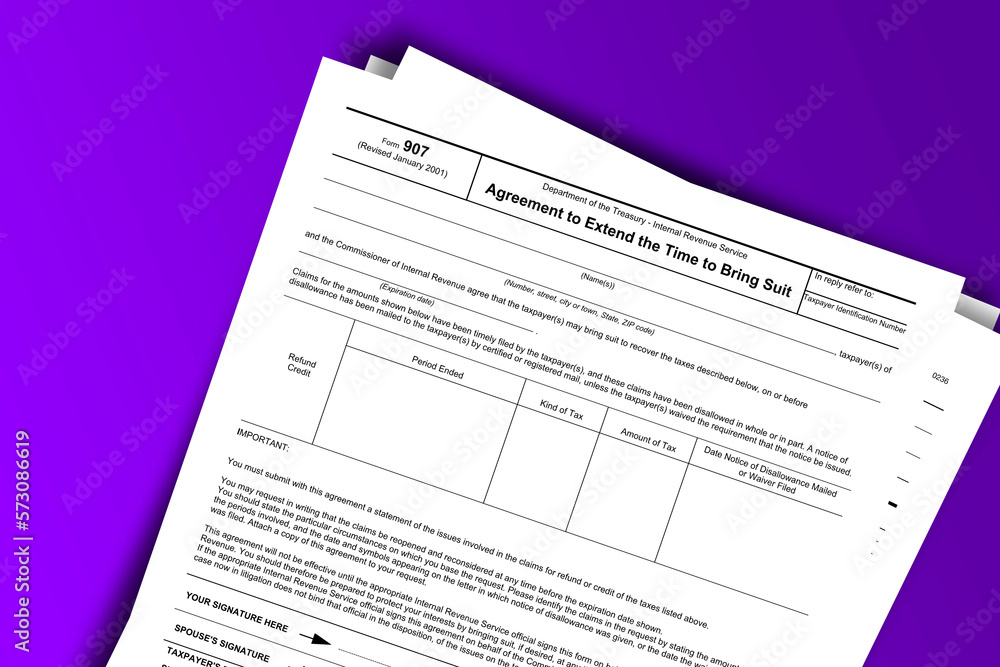 Form 907 documentation published IRS USA 07.17.2012. American tax document on colored Form 907 documentation published IRS USA 07.17.2012. American tax document on colored