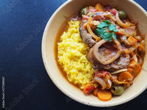Canvastavla Italian Osso Buco alla Milanese : veal shank stew and safran risotto, dark backg