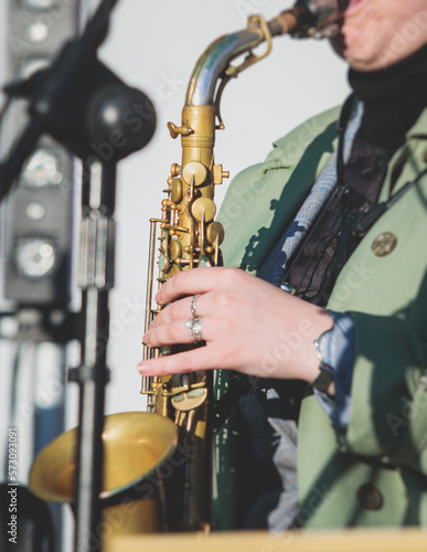 Sticker Concert view of a female saxophonist, professional saxophone player with vocalis