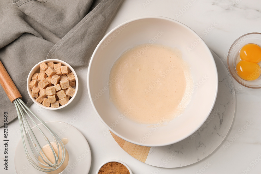 Different ingredients on white marble table, flat lay. Cooking delicious eggnog Different ingredients on white marble table, flat lay. Cooking delicious eggnog
