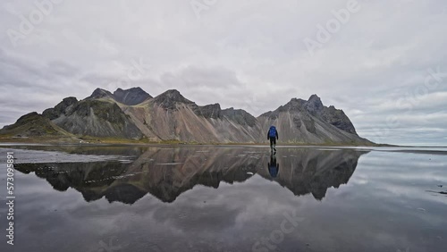 Man Walking Towards Vestrahorn Mountain photo