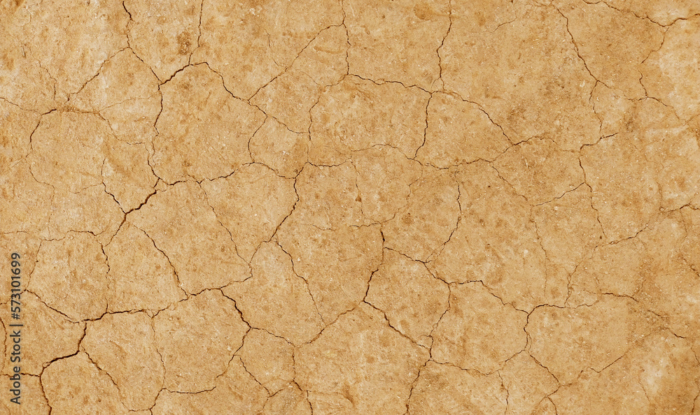 Cracked ground background in the top view for graphic design or wallpaper Cracked ground background in the top view for graphic design or wallpaper