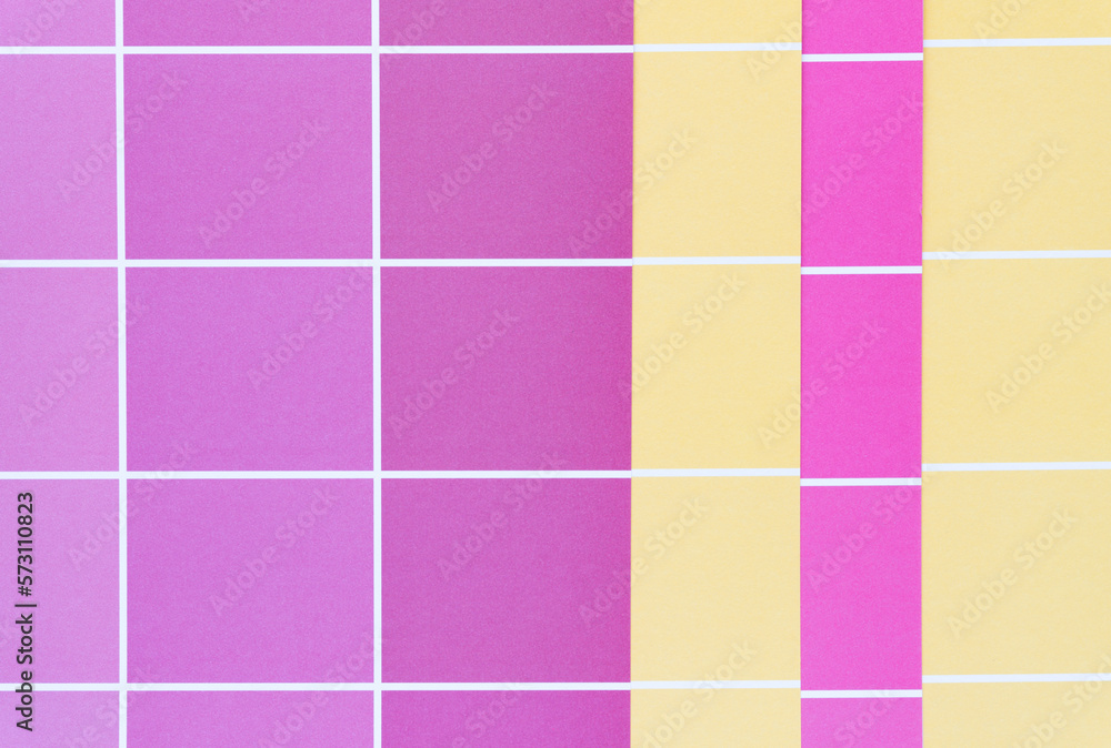 pink and yellow paper pad sheets with grid paint chip element - macro lens, particular focus pink and yellow paper pad sheets with grid paint chip element - macro lens, particular focus