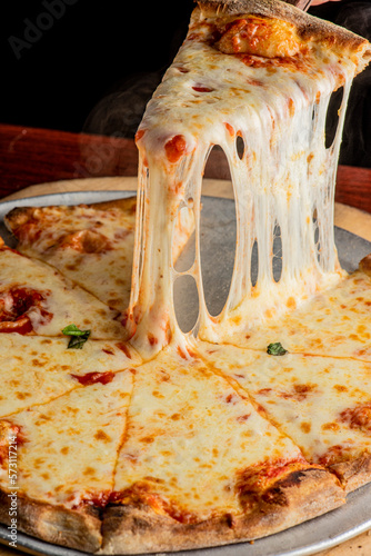 Pizza. Cheese Pizza. Traditional New York City style margarita pizza pie with a thin homemade crispy crust, tomato, garlic, marinara sauce topped with buffalo mozzarella cheese and fresh basil leaves.