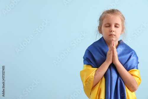 Little girl with flag of Uk...