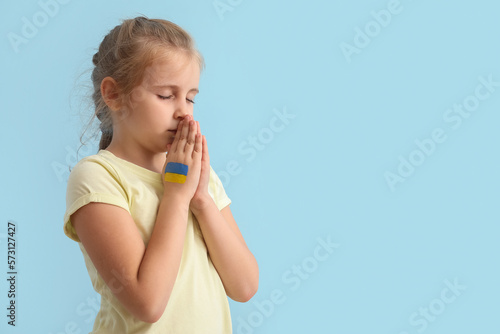 Little girl with drawn flag...