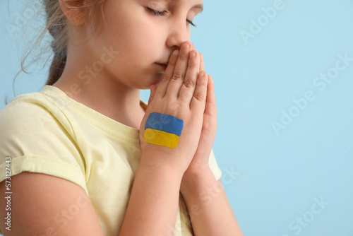 Little girl with drawn flag...