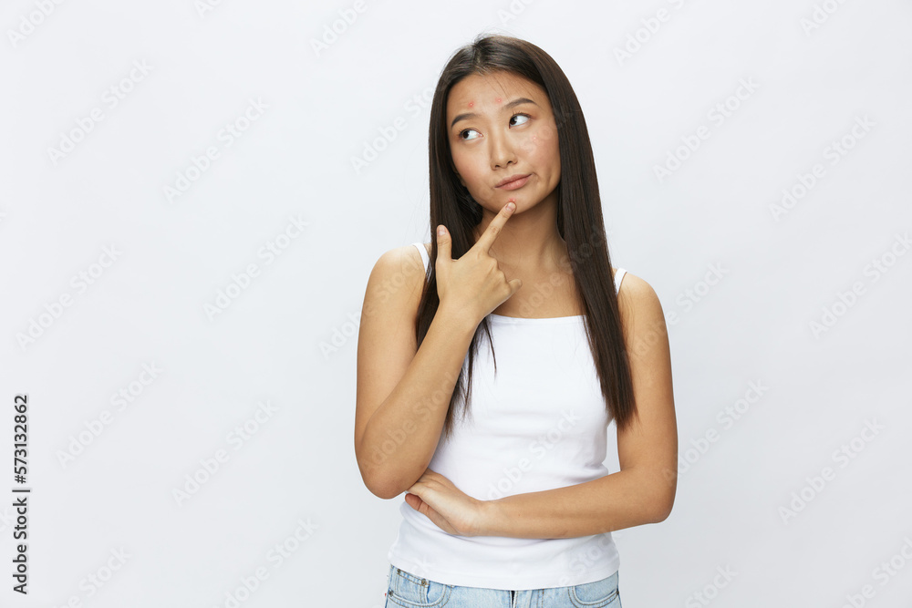 Asian woman facial skin problems, acne and inflammation, red rashes and allergies, chicken pox, sadness from rashes. Facial skin care concept for diseases and nerves Asian woman facial skin problems, acne and inflammation, red rashes and allergies, chicken pox, sadness from rashes. Facial skin care concept for diseases and nerves