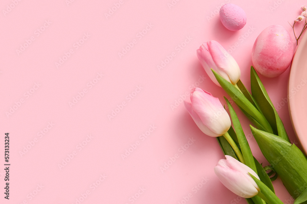 Beautiful tulip flowers and painted Easter eggs on pink background