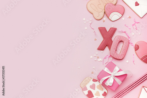 Composition with tasty cookies, straws and gift box on pink background. Valentine's Day celebration