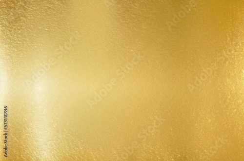 Shiny gold foil polished background with the reflection of golden light.