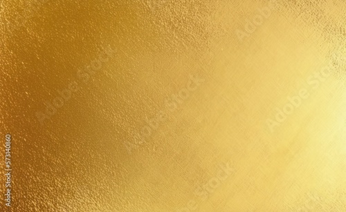 Shiny gold foil polished background with the reflection of golden light.