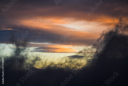 Amazing sunrise sky landscape. Clouds in spectaculare shapes and color during an orange vivid color sunrise view. Great for wallpaper and background image.