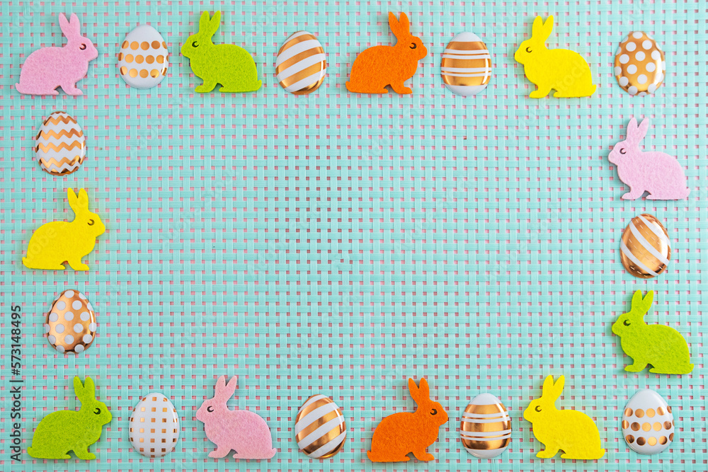 Colorfull eggs andl rabbits on blue background