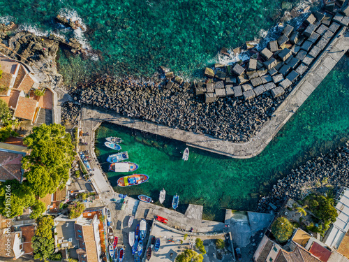 Stunning aerial shot of San Giovanni li Cuti, a charming neighborhood in Catania overlooking the sea. The image features a bird's eye view of the picturesque harbor photo