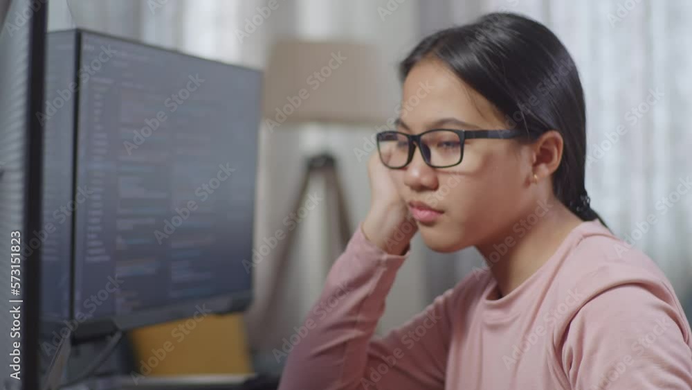 Close Up Of Asian Teen Girl Programmer Being Bored Creating Software Engineer Developing App, Program, Video Game On Desktop Computer At Home. Terminal With Coding Language
Close Up Of Asian Teen Girl Programmer Being Bored Creating Software Engineer Developing App, Program, Video Game On Desktop Computer At Home. Terminal With Coding Language
