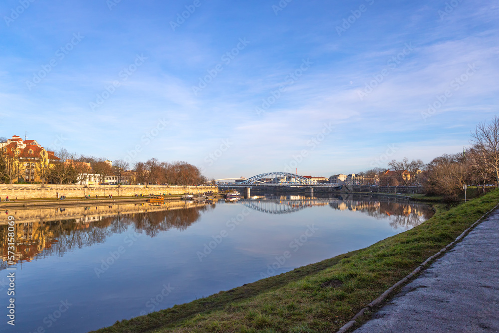 Obraz premium Krakow. Poland. Beautiful embankment of the Vistula River, with beautiful bridges. Sunny day. Sights of Krakow.