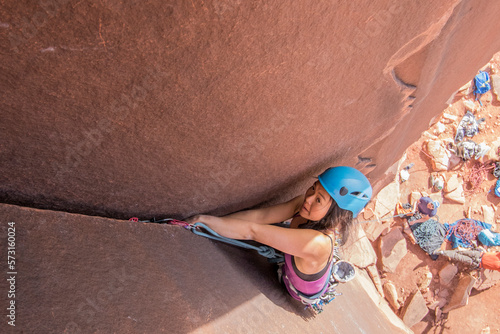 High angle view of woman climbing rock, Utah, USA photo