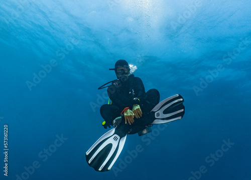 female diver relaxing at the 5 meter /15 feet 3 minute safety stop photo