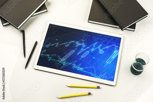 Digital tablet with abstract financial graph, finance and trading concept. Top view. 3D Rendering