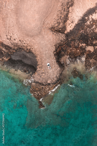 Drone view to seashore and car