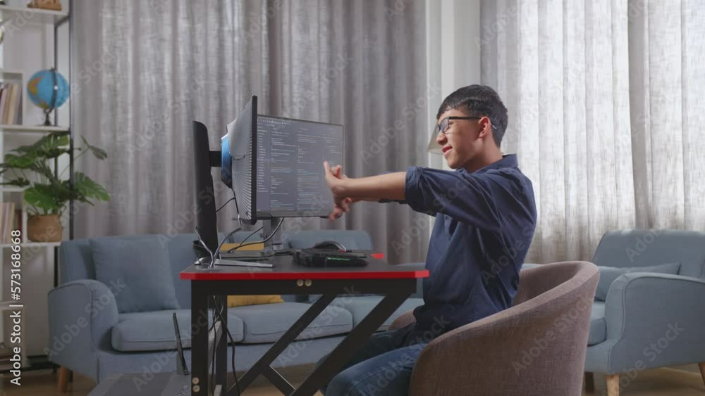 Asian Boy Programmer Stretching While Creating Software Engineer Developing App, Program, Video Game On Desktop Computer At Home. Terminal With Coding Language
Asian Boy Programmer Stretching While Creating Software Engineer Developing App, Program, Video Game On Desktop Computer At Home. Terminal With Coding Language