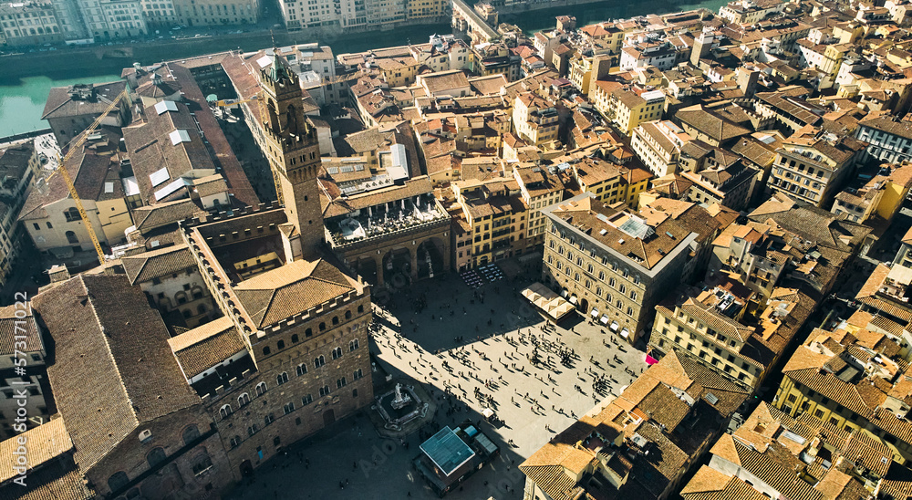 Aerial view of famous tower and Palazzo Vecchio square and Florence cityscape, Italy. High quality photo