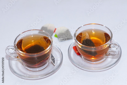 Isolated image of two cups of leaf herbal tea with white background and copy space