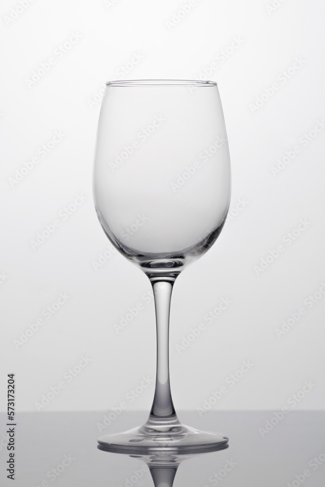 Empty wine glass close-up, isolated in backlight Empty wine glass close-up, isolated in backlight