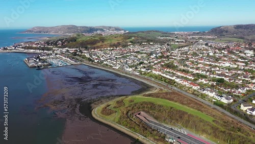 Aerial footage of the town of Deganwy in Conwy County Borough in Wales It lies in the Creuddyn Peninsula alongside Llandudno Rhos-on-Sea showing the A55 North Wales Expressway along the Conwy river photo