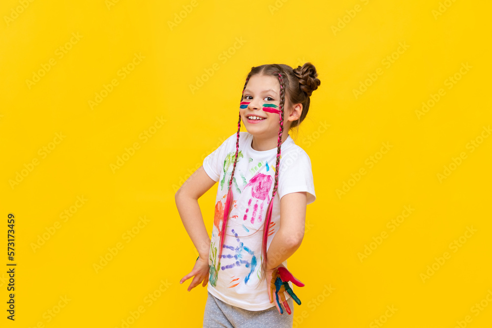 A little girl smeared with gouache. The girl got smeared in paint. The child smeared his hands and T-shirt with paint. A little girl smeared with gouache. The girl got smeared in paint. The child smeared his hands and T-shirt with paint.